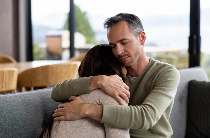 husband consoling his wife who's struggling with an eating disorder